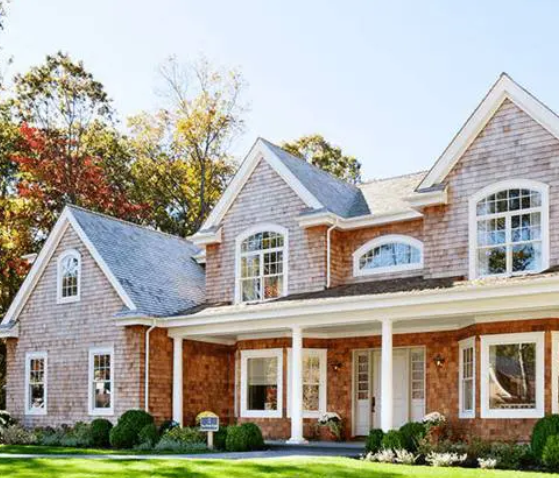 A large brick house with a lot of windows.